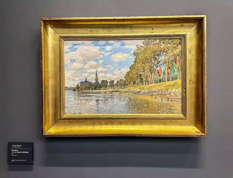 Claude Monet painting of the River Zaan and Dutch houses in the Netherlands.