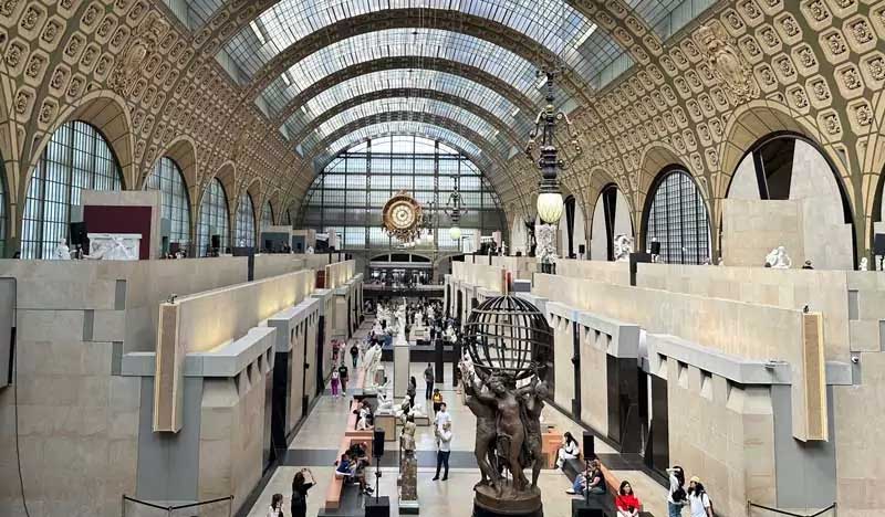 Ground floor view of the Musée d’Orsay with the grand hall and exhibitions.
