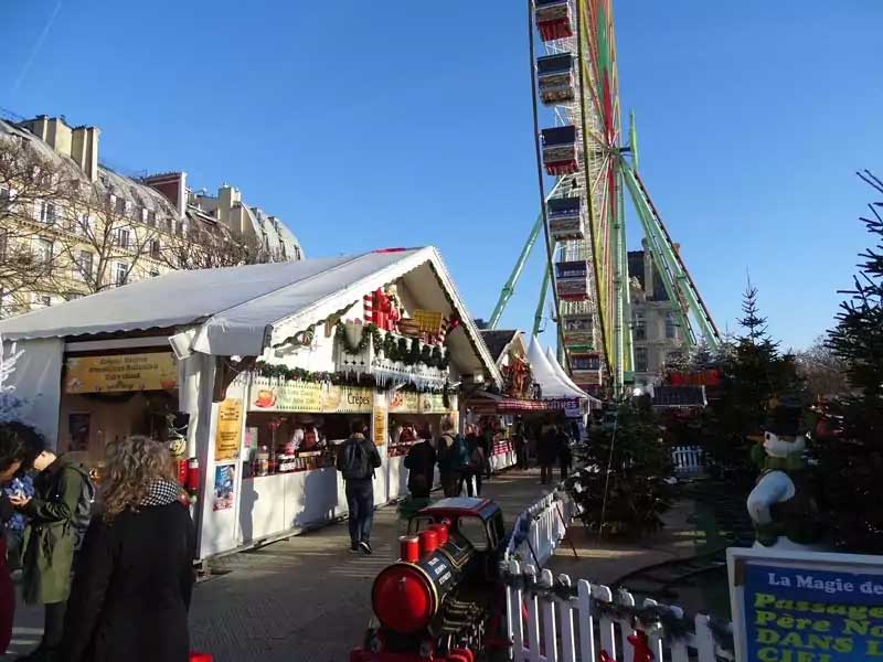 Tuileries Christmas Market in Paris with Ferris wheel and festive lights