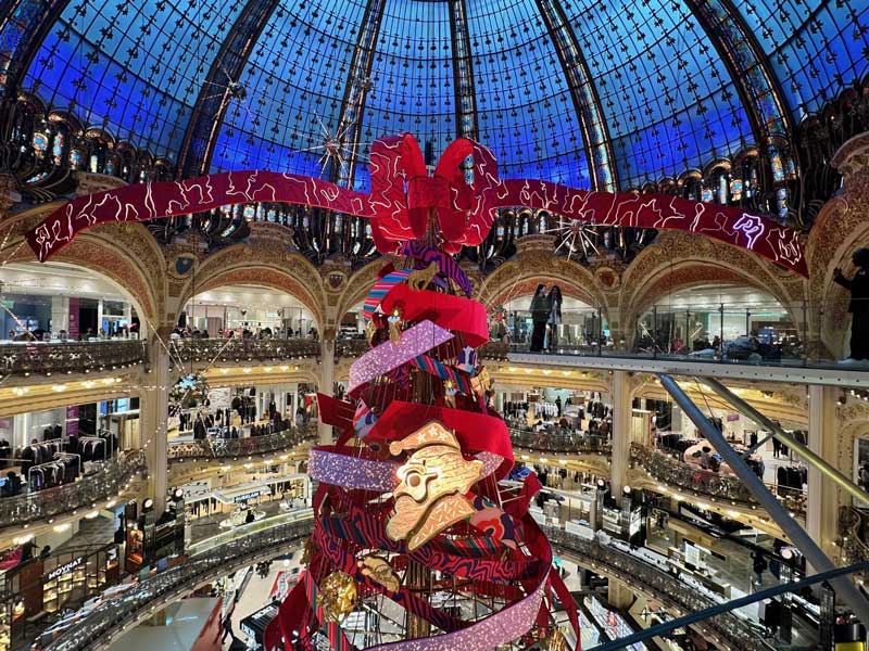 Giant Christmas tree under the glass dome at Galeries Lafayette in Paris