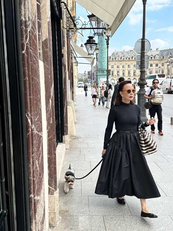 Woman in glamorous designer outfit in Paris, Place Vendôme.