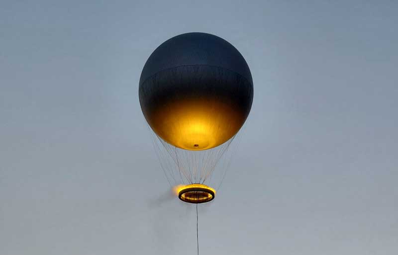 Every evening at dusk, weather permitting, the balloon (Olympic flame) rises more than 60 meters, or about 200 feet, into the air